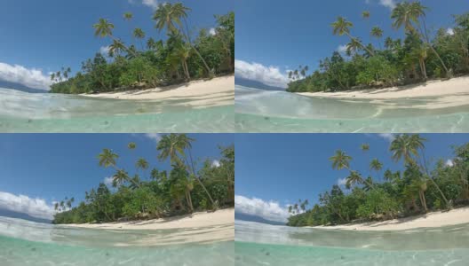 半进半出:海蓝宝石色调的纯净海洋靠近斐济的沙滩海岸线高清在线视频素材下载