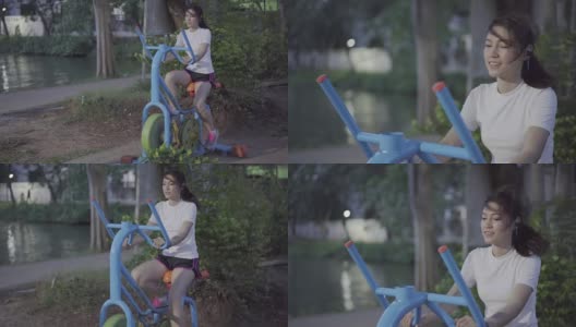 在公园里骑自行车锻炼的女人高清在线视频素材下载