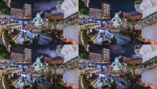 中国，香港- 11月14日214:中国香港九龙，许多人在酒店前观看并为这棵巨大的圣诞树拍照高清在线视频素材下载