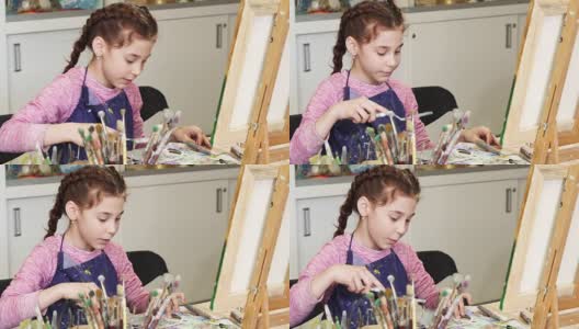 美丽快乐的小女孩在艺术工作室对着镜头微笑高清在线视频素材下载