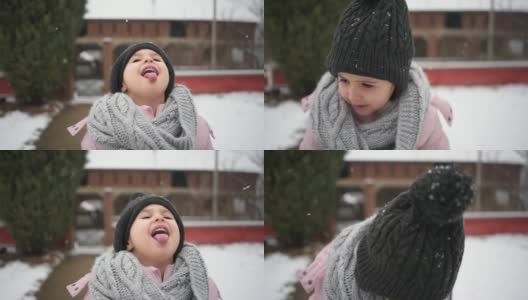 雪花落在一个可爱的四岁小女孩的脸上高清在线视频素材下载