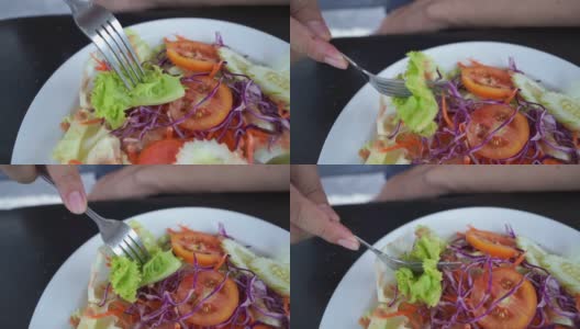 特写，人的手在吃沙拉高清在线视频素材下载