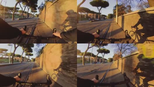 骑自行车:路上自行车的影子在墙上高清在线视频素材下载