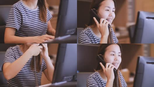 在呼叫中心用电话工作的年轻女子高清在线视频素材下载