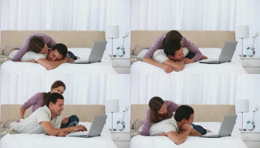 可爱的女人抱着她的男朋友躺在床上高清在线视频素材下载