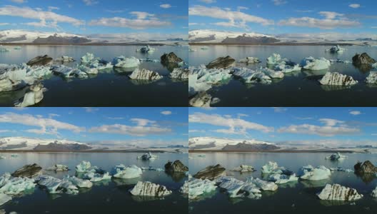 4K空中电影飞越冰川碎片泻湖，冰岛Jokulsarlon高清在线视频素材下载