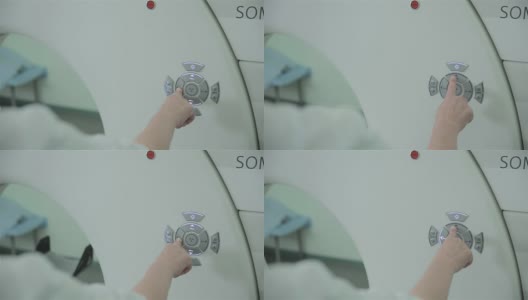 不认识医生的手操作计算机断层扫描CT MRI扫描仪高清在线视频素材下载