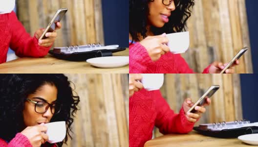 美女一边喝咖啡一边玩手机高清在线视频素材下载