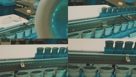 灰色塑料管和蓝色集装箱在工厂的输送带上移动高清在线视频素材下载