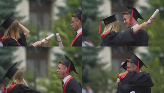 两个朋友在毕业典礼上拥抱，年轻人庆祝成就高清在线视频素材下载