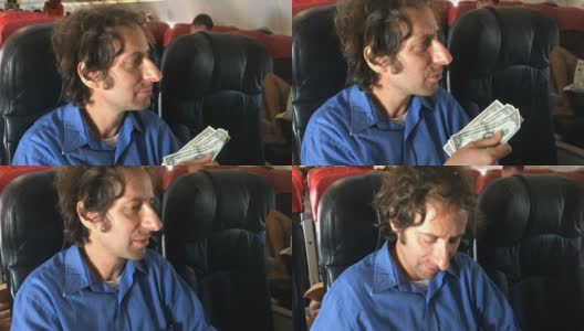 一位沮丧的旅行者在飞机上用现金买东西时遇到了困难高清在线视频素材下载
