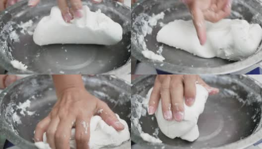 亚洲年轻女子正在做泰国饺子甜点或布阿洛伊糖果。将面粉和椰奶混合，揉成面团，做成布阿洛伊球的过程的特写。高清在线视频素材下载