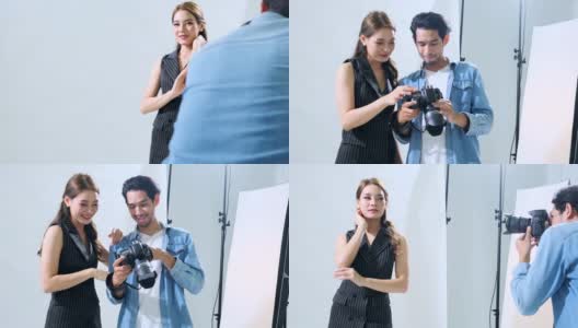 年轻的亚洲男性摄影师展示照片给女模特在相机显示手持拍摄高清在线视频素材下载