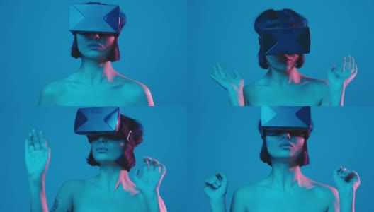 年轻女子通过一个虚拟现实头盔孤立在蓝色霓虹copyspace虚拟现实高清在线视频素材下载