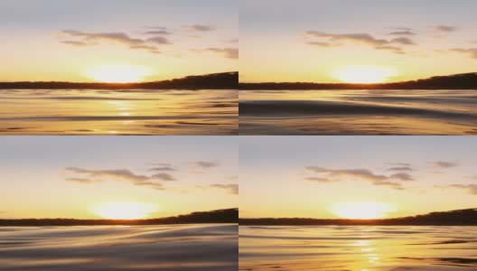 在印度古吉拉特邦Wankaner的Vadsar湖，夕阳在湖水中反射的太阳高清在线视频素材下载