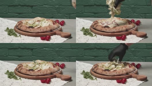 厨师将卷心莴苣加在烤披萨底上高清在线视频素材下载