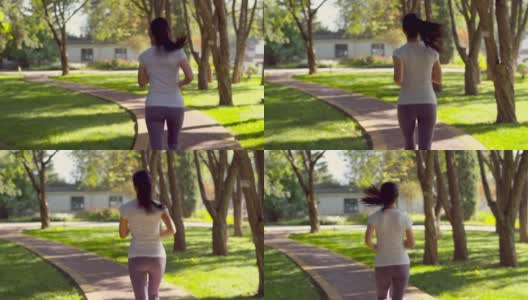 年轻的亚洲女性在城市公园跑步高清在线视频素材下载