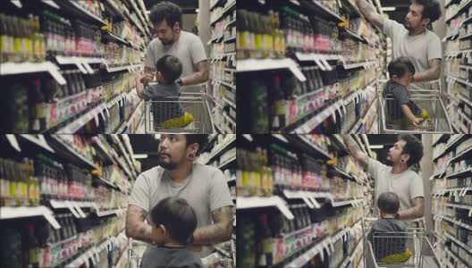 一个带着小男孩在杂货店的年轻人高清在线视频素材下载
