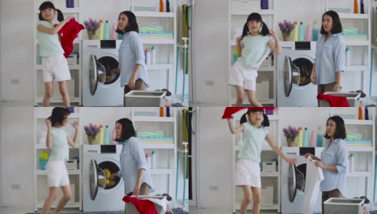 亚洲母亲和女儿在打扫或清洗时玩耍。高清在线视频素材下载