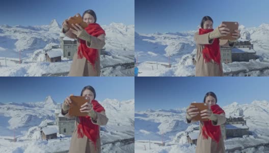 年轻女子在马特洪峰独自旅行时，喝着一杯热咖啡高清在线视频素材下载