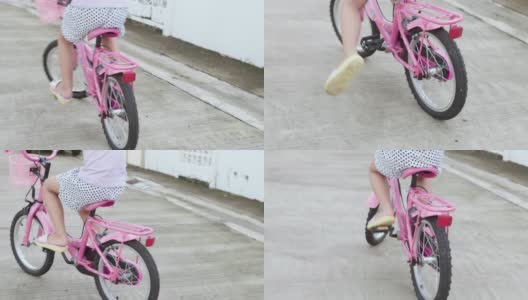 孩子们在夏天的柏油马路上骑自行车。高清在线视频素材下载