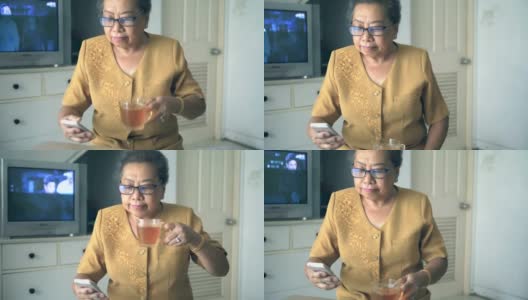 老女人喝酒用电话高清在线视频素材下载