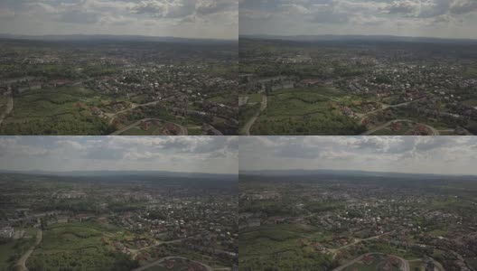 全景鸟瞰。中欧:波兰小镇Kolaczyce坐落在绿色的群山之中。气候温和。无人机或四轴飞行器。高清在线视频素材下载