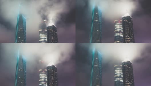 T/L TD现代摩天大楼在上海夜间流动的雾高清在线视频素材下载