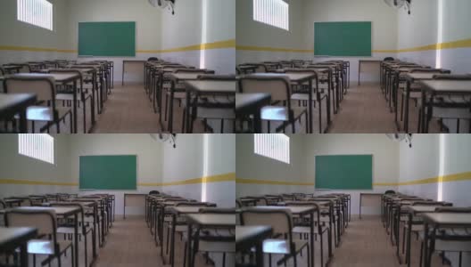 空桌子坐在空教室里-学校的主题高清在线视频素材下载