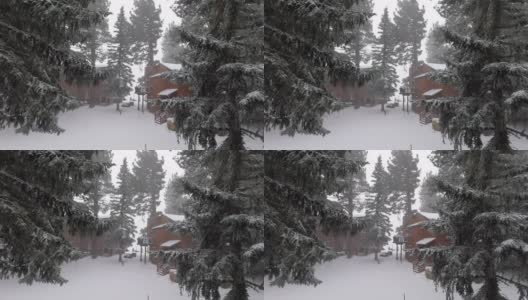 雪下的房子和树城市的窗户和阳台下的降雪视频…保存高清在线视频素材下载