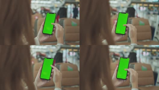 亚洲女性在机场使用色度键智能手机高清在线视频素材下载