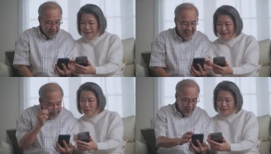 4K亚洲老年夫妇在家享受智能手机高清在线视频素材下载