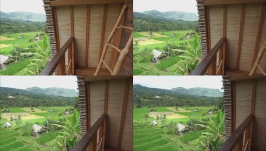从别墅高清视频观看稻田和小山。巴厘岛Karangasem偏远的塞德门的自然美景。巴厘岛风景视频。高清在线视频素材下载