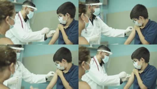 医生给青少年注射新冠病毒疫苗高清在线视频素材下载