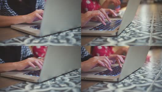 在咖啡店用笔记本电脑打字的女人，摄影高清在线视频素材下载