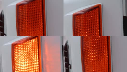 白色卡车上的橙色转向灯闪烁着明亮的灯光高清在线视频素材下载