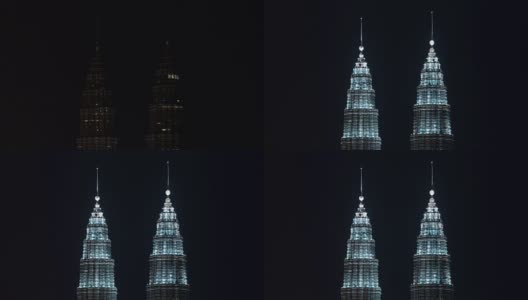 马来西亚国家石油双塔夜间照明的延时，吉隆坡高清在线视频素材下载
