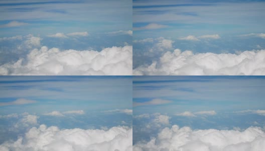 4 k鸟瞰图。飞过蓬松的白云蓝天。cloudscape背景高清在线视频素材下载