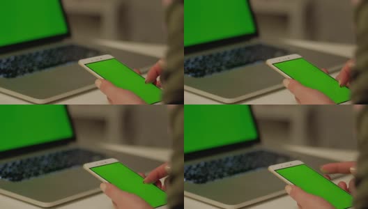 女孩用绿色屏幕触摸手机高清在线视频素材下载