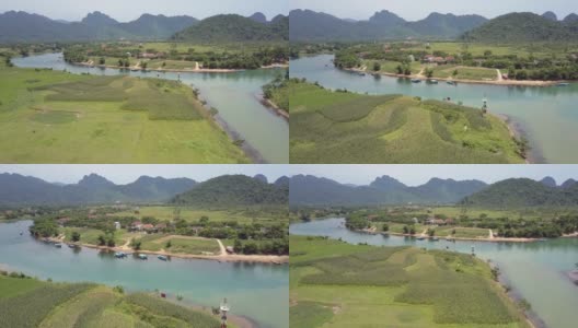 运动在河上的田野与村庄在河岸上的视图高清在线视频素材下载