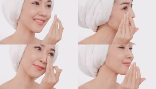 亚洲妇女的肖像与光滑的嘴唇在她的脸上涂霜。高清在线视频素材下载