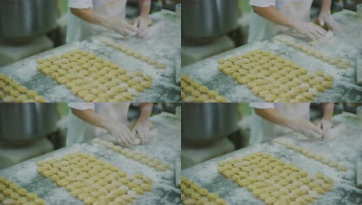 马来西亚东部美里的面包师在专门制作不同月饼的饼干和饼干工厂组装月饼配料高清在线视频素材下载