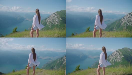 穿白裙子的女孩在加尔达湖上慢动作高清在线视频素材下载