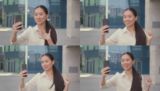 韩国女性在城市里用手机视频通话高清在线视频素材下载