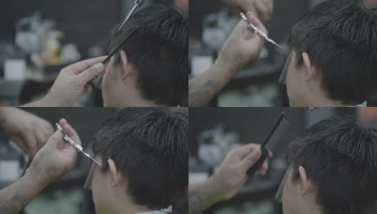 亚洲男孩坐在理发店剪发高清在线视频素材下载