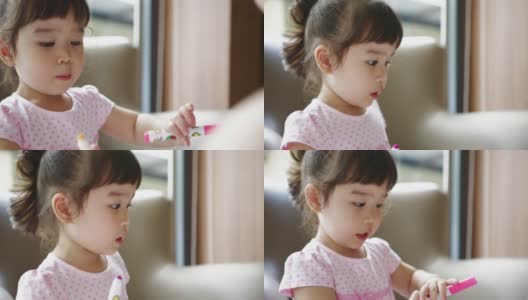 年轻的亚洲女孩学习一种颜色和练习绘画高清在线视频素材下载