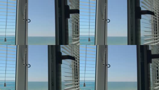 透过打开的白色窗户可以看到海景高清在线视频素材下载