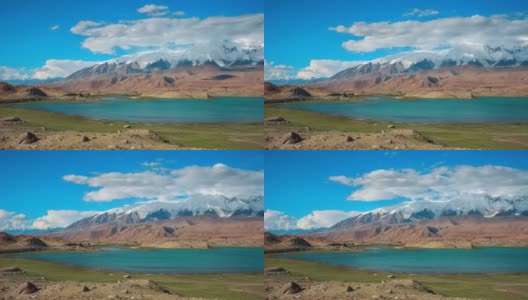 白雪皑皑的山峰和绿松石般的湖水高清在线视频素材下载