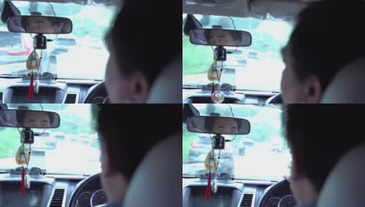 男人在开车时照镜子高清在线视频素材下载