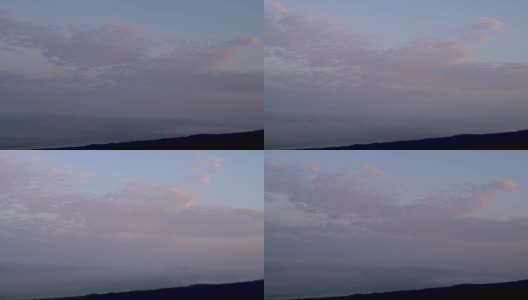 间隔拍摄视频。俄罗斯堪察加半岛的托尔巴克火山上的日出和云景。高清在线视频素材下载